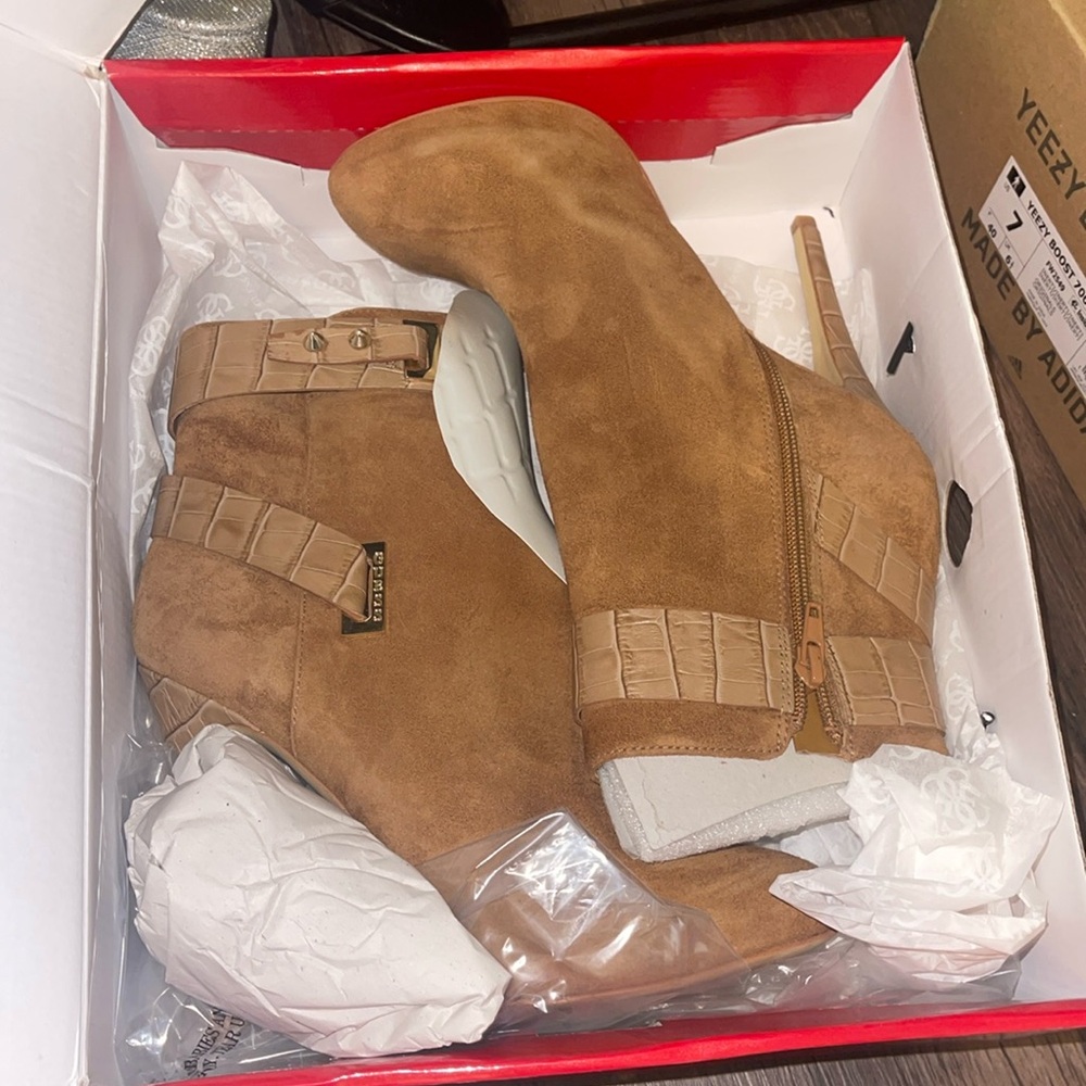 Brand new guess heeled boots, in original box, never worn